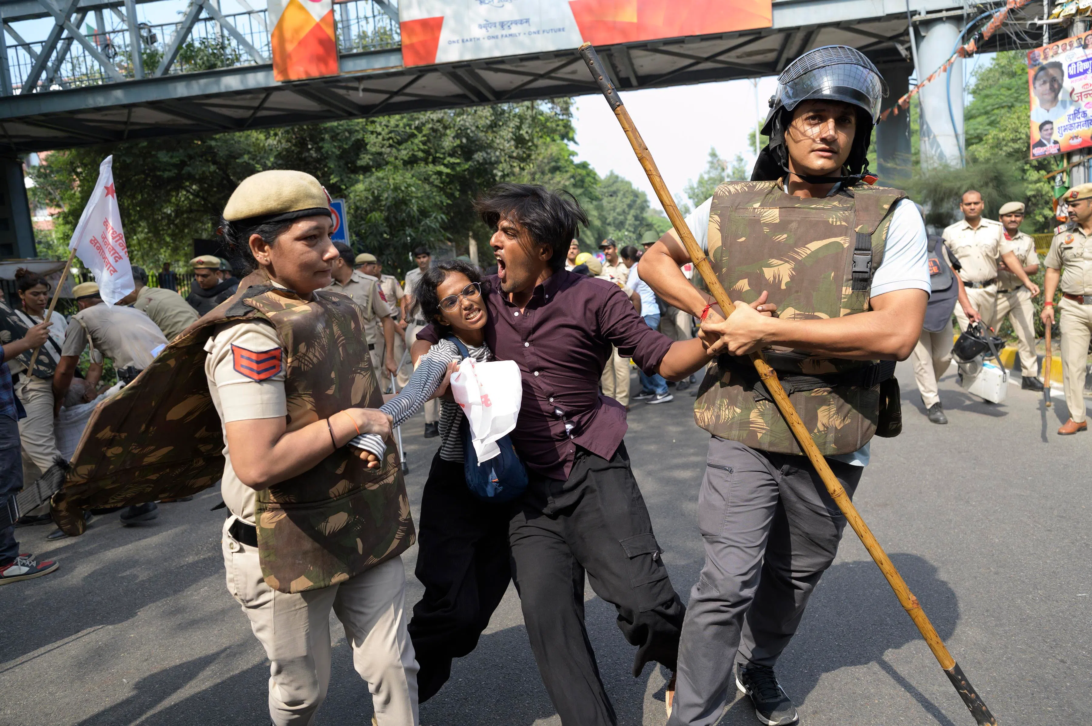 Security personnel detaining protesters in New Delhi, India, on Oct 10.