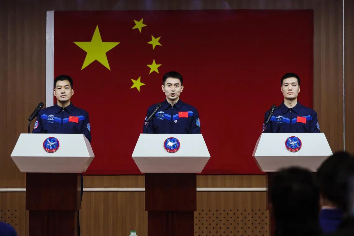 Astronaut of Shenzhou-18 spaceflight mission Ye Guangfu (centre), speaks during a press conference in Jiuquan, Gansu province, China, on April 24.