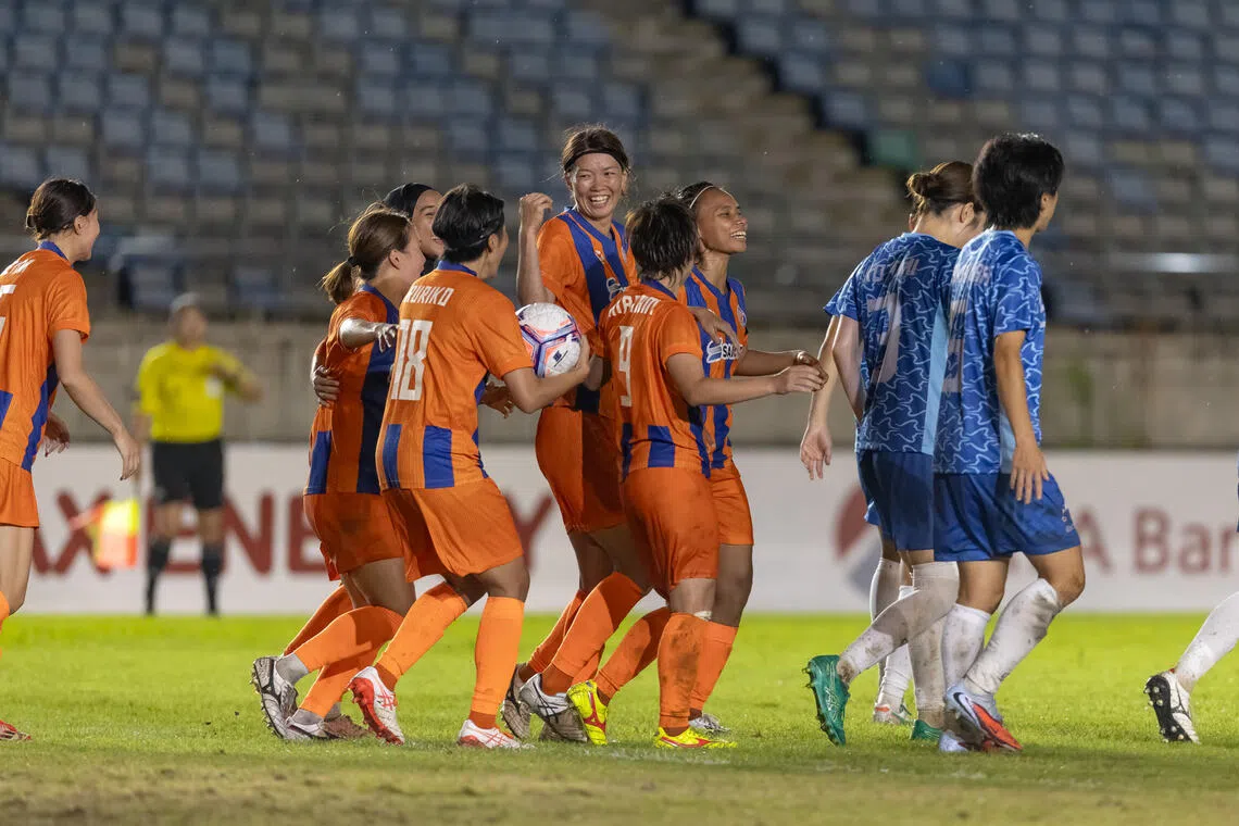 FC Jurong’s Kana Kitahara (tallest) celebrating after scoring her team’s first goal in the Asian Football Confederation Women’s Champions League on Aug 20. They eventually fell to a narrow 2-1 loss to Taiwanese side New Taipei City Hang Yuan FC.