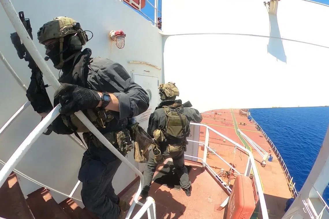 This video grab taken by French Navy forces on June 23, 2026 and released on June 25, 2026 shows French soldiers intercepting the oil tanker 'Deliver' in the Mediterranean Sea and suspected of being part of Russia's "ghost fleet". This is the fifth oil tanker suspected of being part of this 'ghost fleet' that France has boarded since September 2025. The 'Deliver' was sailing under "a Cameroonian flag" and was "coming from Primorsk, Russia" the Mediterranean Prefecture said. (Photo by Handout / Etat-Major des Armees / AFP) / RESTRICTED TO EDITORIAL USE - MANDATORY CREDIT "AFP PHOTO / État-major des armées" - HANDOUT - NO MARKETING NO ADVERTISING CAMPAIGNS - DISTRIBUTED AS A SERVICE TO CLIENTS