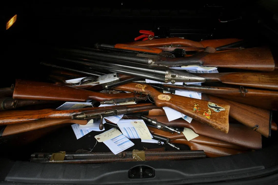 Tagged guns are stacked in the trunk of a car in Lisle-sur-Tarn, south-western France. From Nov 25 to Dec 2, undeclared holders of weapons found or acquired by inheritance can go to specially opened sites throughout French territory to either dispose of them or register them.