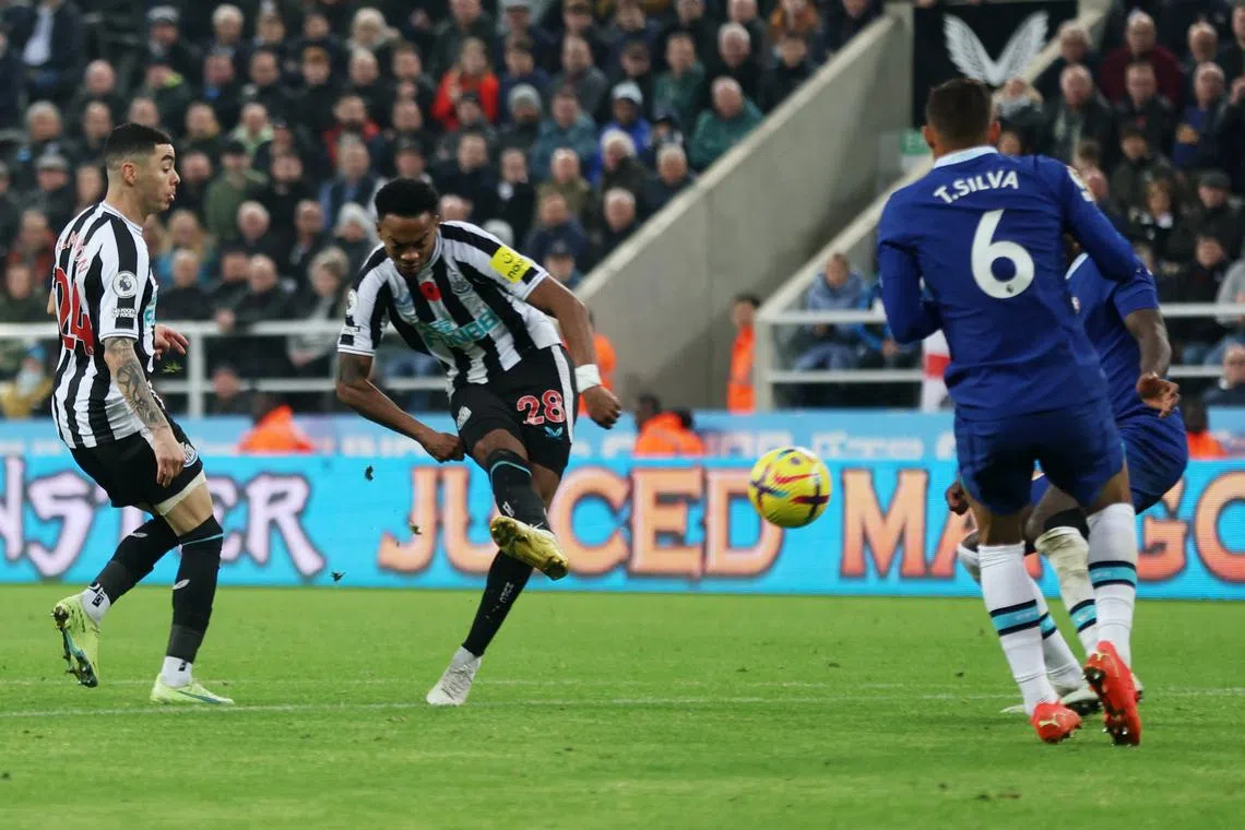 Newcastle United's Joe Willock scores their first goal.