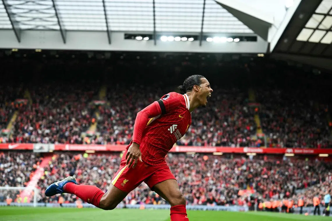 Liverpool's Dutch defender Virgil van Dijk celebrating after netting the winner in a 2-1 English Premier League triumph at home to West Ham United on April 13 at Anfield.