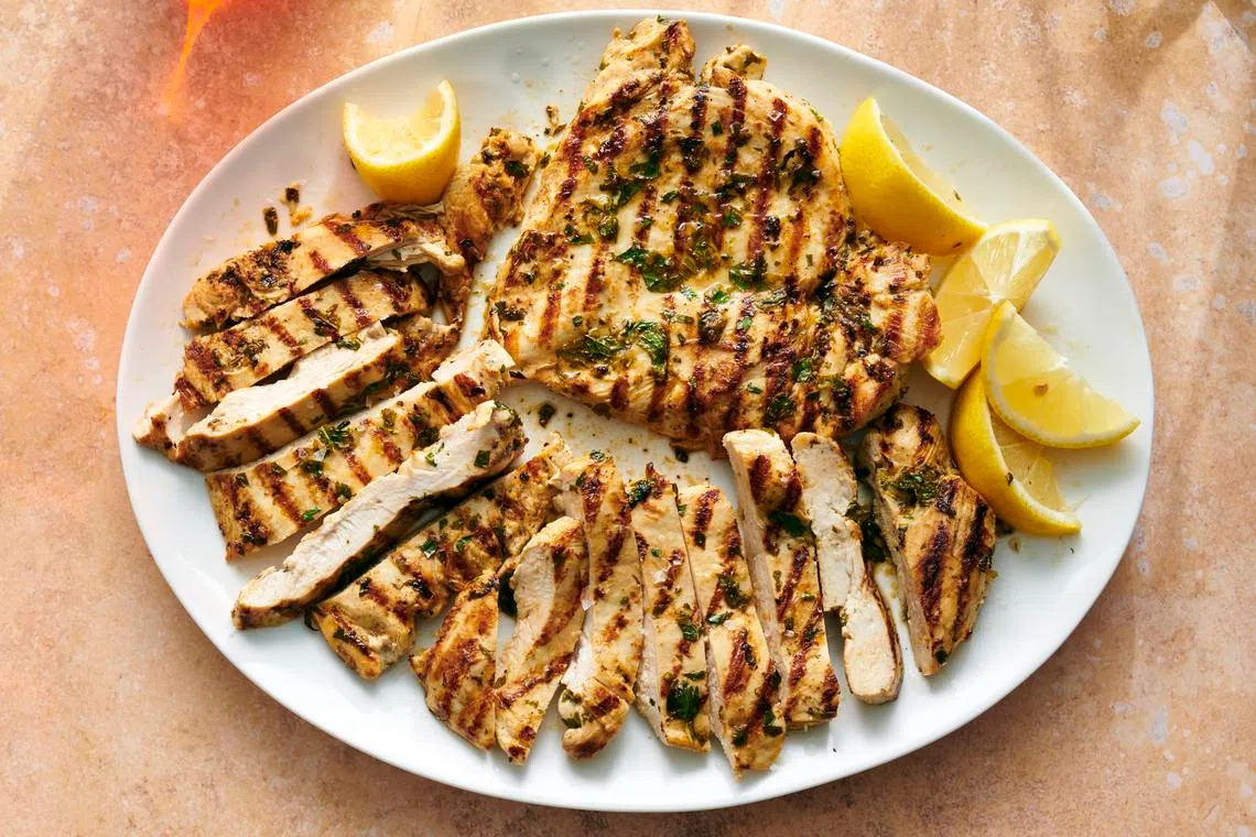 Lemon-garlic grilled chicken breasts.