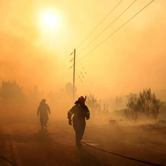 Firefighters battle a wildfire near the Agia Paraskevi village, Greece, on Aug 2, 2026.