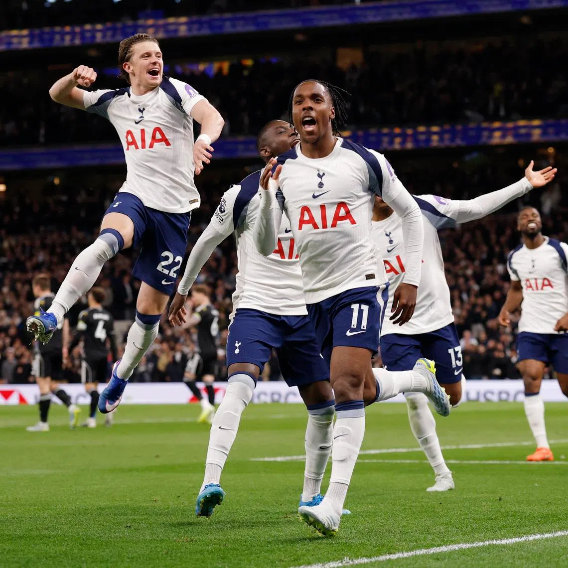 Tottenham Hotspur's Mathys Tel celebrates scoring their first goal with Randal Kolo Muani and Conor Gallagher over Leeds United.