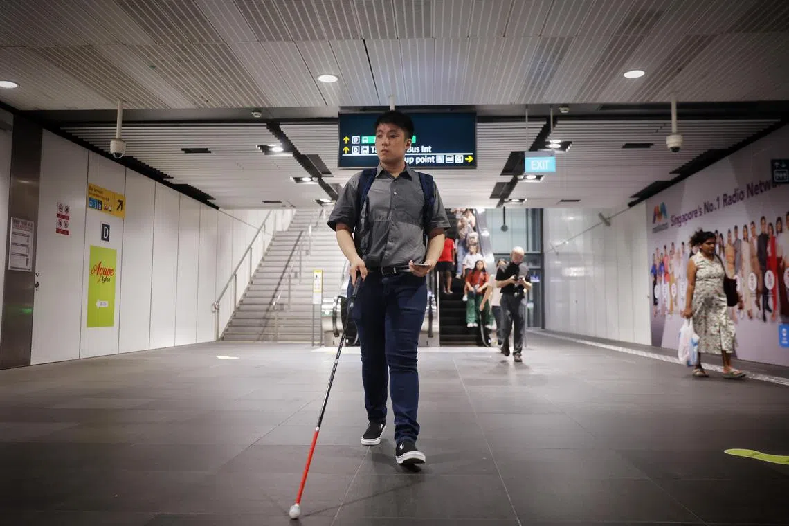 ST20231010_202325571543/yfmap10/Yufeng/Jason Quah

Mr Joshua Tseng, 26, an executive committee member at the Singapore Association of the Visually Handicapped, using Waymap-SG at Tampines MRT station on the downtown line, on Oct 10, 2023.
//
SBS Transit and British firm Waymap are launching Waymap-SG, an audio-based application to help the visually impaired navigate bus interchanges and MRT stations independently and safety. The app is the first of it's kind in the Asia-Pacific region and it will be trialled at Tampines Bus Interchange and Tampines MRT station on the Downtown Line.
