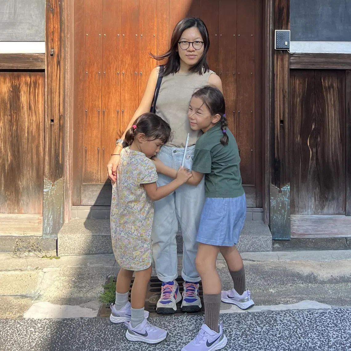 The Singaporean writer – seen here with her daughters on a trip to Japan – reflects on being mistaken for a Chinese national abroad.