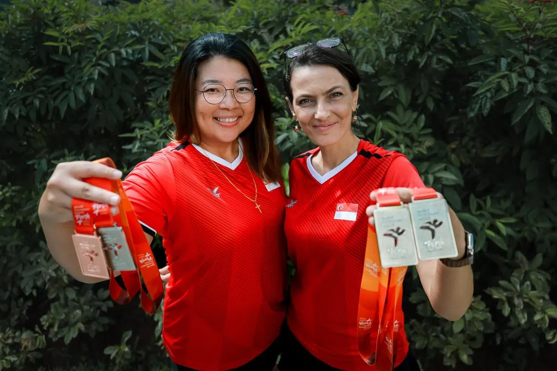 From right: Ms Galina Ivanova, 45, and Ms Jamie Yeow, 43, with their medals they won at the World Transplant Games in April.