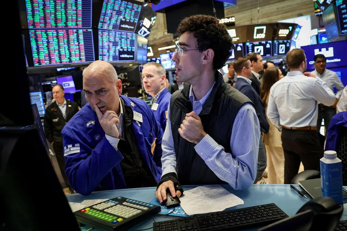Specialist traders working on the floor of the New York Stock Exchange, in New York City.