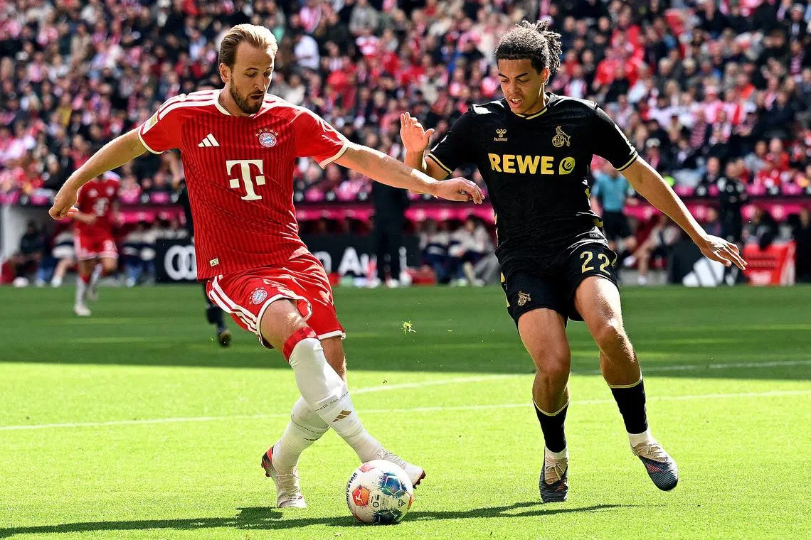 Soccer Football - Bundesliga - Bayern Munich v FC Cologne - Allianz Arena, Munich, Germany - May 16, 2026 Bayern Munich's Harry Kane in action with FC Cologne's Jahmai Simpson-Pusey REUTERS/Angelika Warmuth