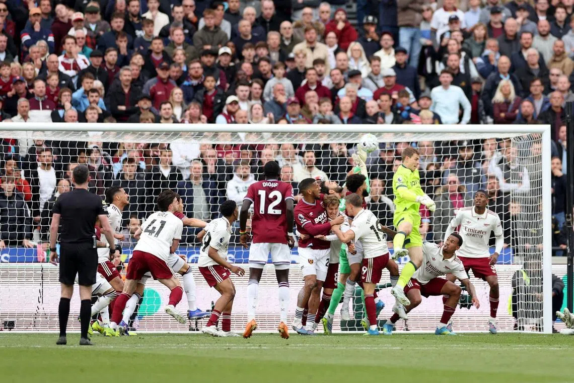 West Ham United and Arsenal players tussling in the penalty area during the corner which led to the Hammers' disallowed goal, as the Gunners claimed a 1-0 EPL win on May 10. 