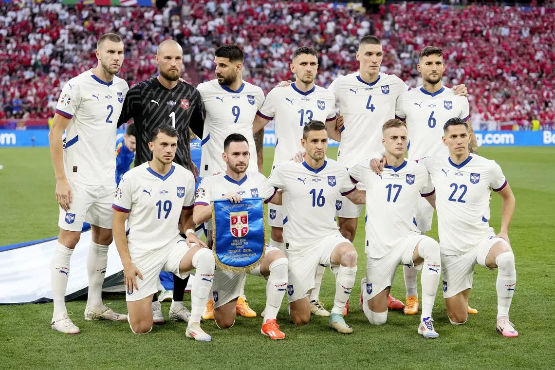 Soccer Football - Euro 2024 - Group D - Denmark v Serbia - Munich Football Arena, Munich, Germany - June 25, 2024 Serbia players pose for a team group photo before the match REUTERS/Fiona Noever