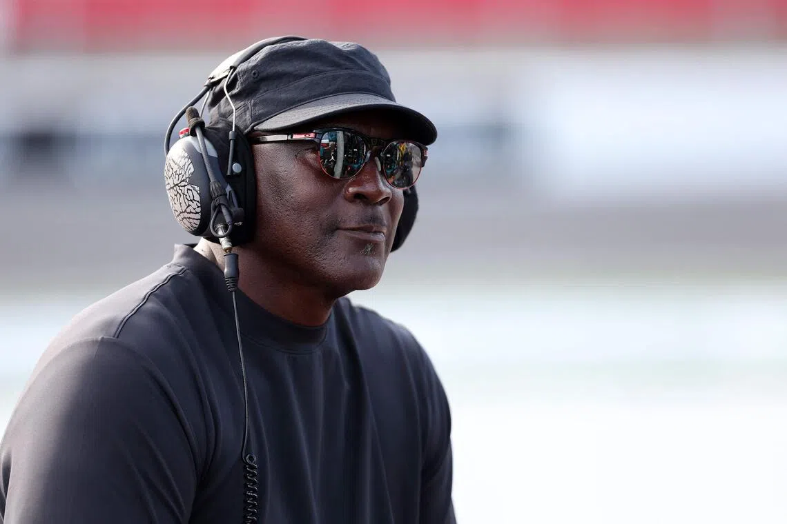 Michael Jordan, NBA Hall of Famer and co-owner of 23XI Racing listening to the race on pit road during the Nascar Cup Series Bank of America ROVAL 400 at Charlotte Motor Speedway on Oct 5, 2025 in Concord, North Carolina. 
