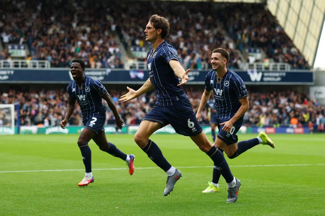 Millwall’s Caleb Taylor celebrates scoring their first goal against West Ham United at The Den in London, on Sept 19.