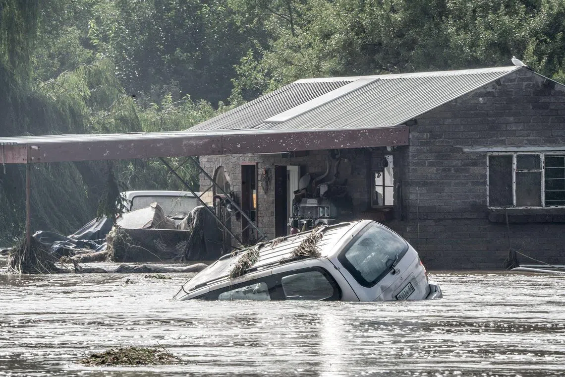 A car is submerged under water in Lochvaal, South Africa on Feb 19, 2023 after heavy rainfall wreaked havoc with the Vaal dam exceeding maximum capacity resulting in the Vaal River being flooded. 