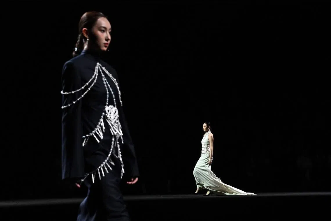 Models presenting creations by fashion designer Yan Liang during the China Fashion Week in Beijing, China on March 26, 2026. 