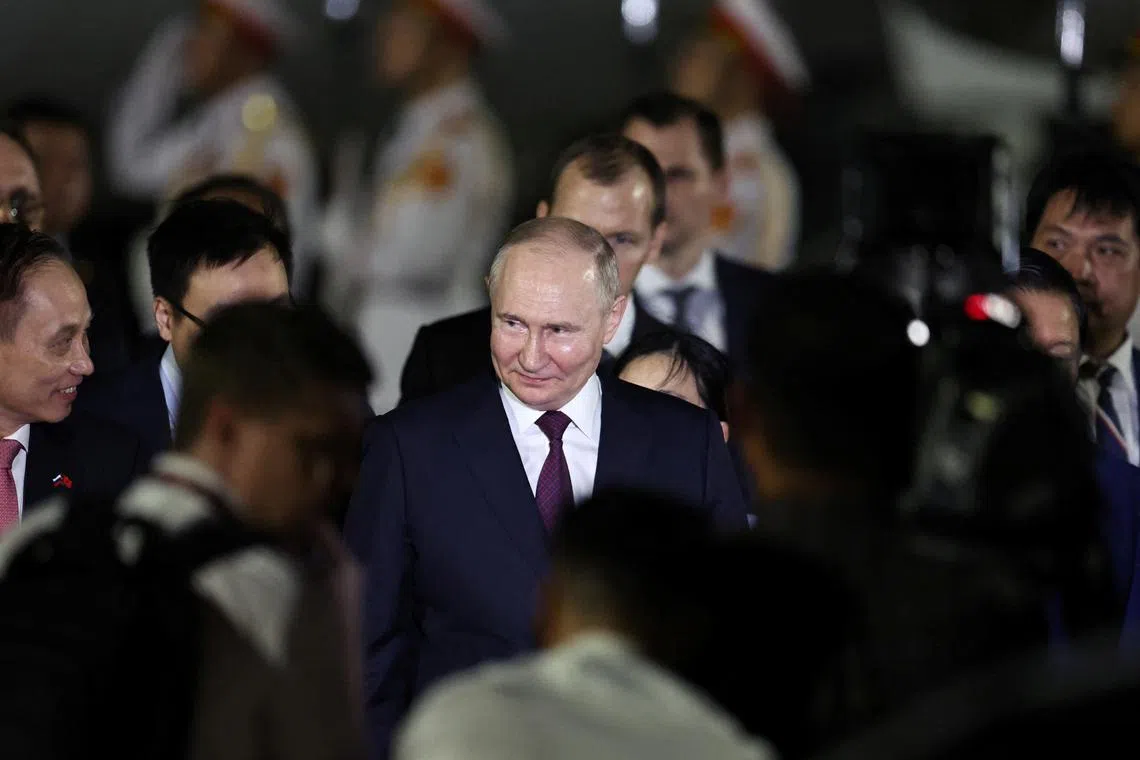 Russian President Vladimir Putin arrives at Noi Bai International Airport for his visit to Hanoi, on June 20.