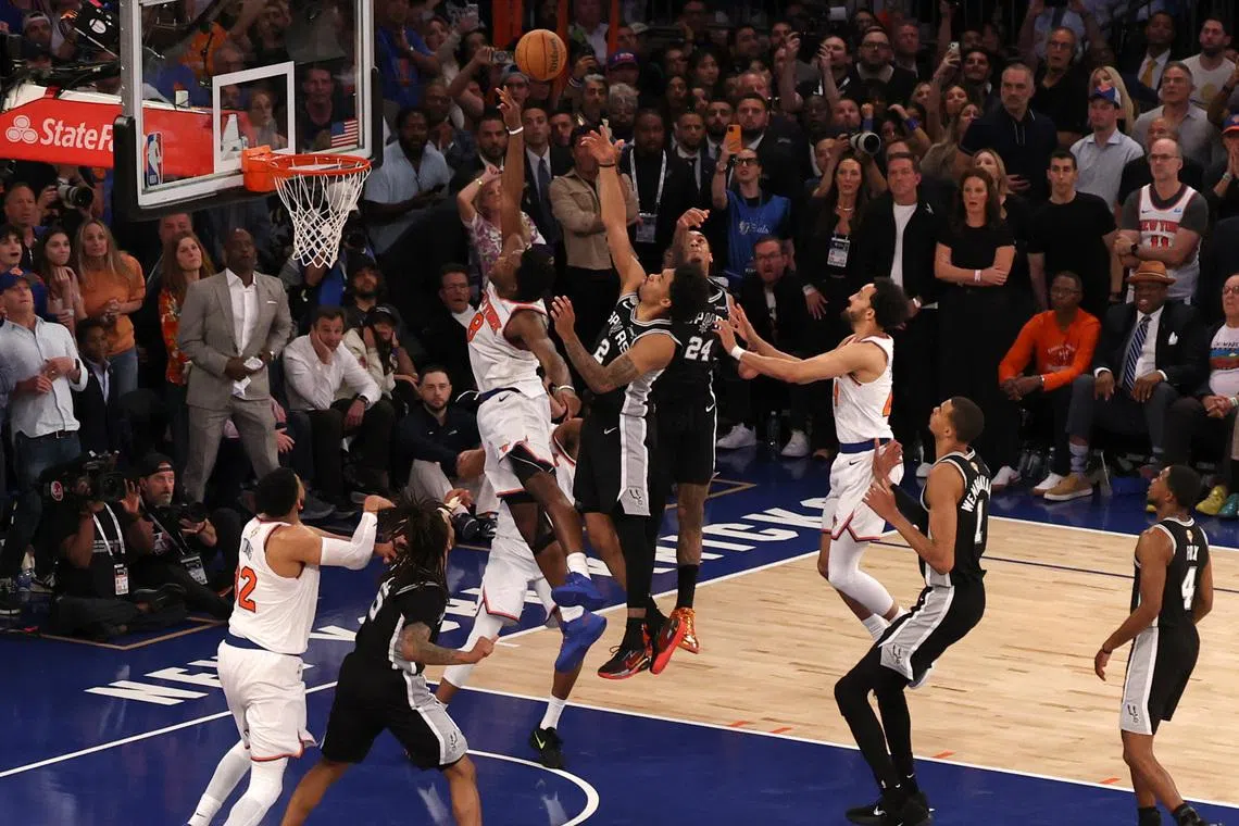 Jun 10, 2026; New York, New York, USA; New York Knicks forward Og Anunoby (8) scores on a rebound against San Antonio Spurs guard Dylan Harper (2) in the fourth quarter during game four of the 2026 NBA Finals at Madison Square Garden. Mandatory Credit: Geoff Burke-Imagn Images