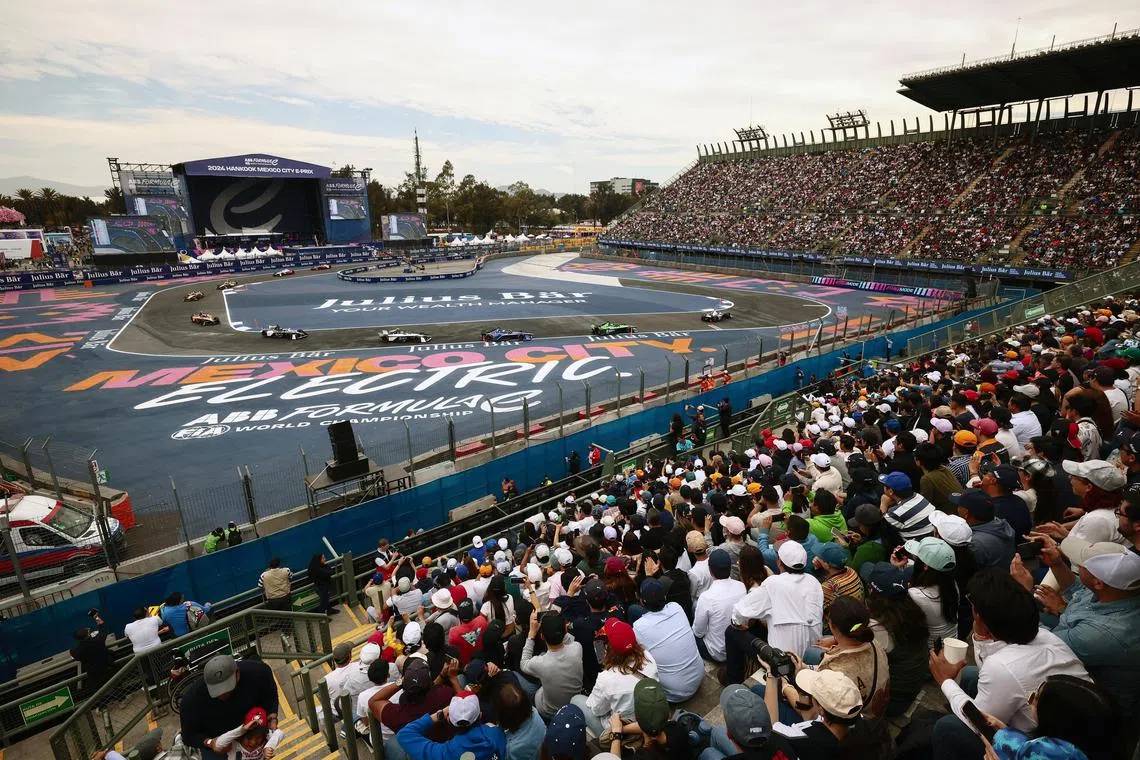 A general view over race cars passing the crowded Foro Sol during the Formula E Mexico City E-Prix in January 2024.