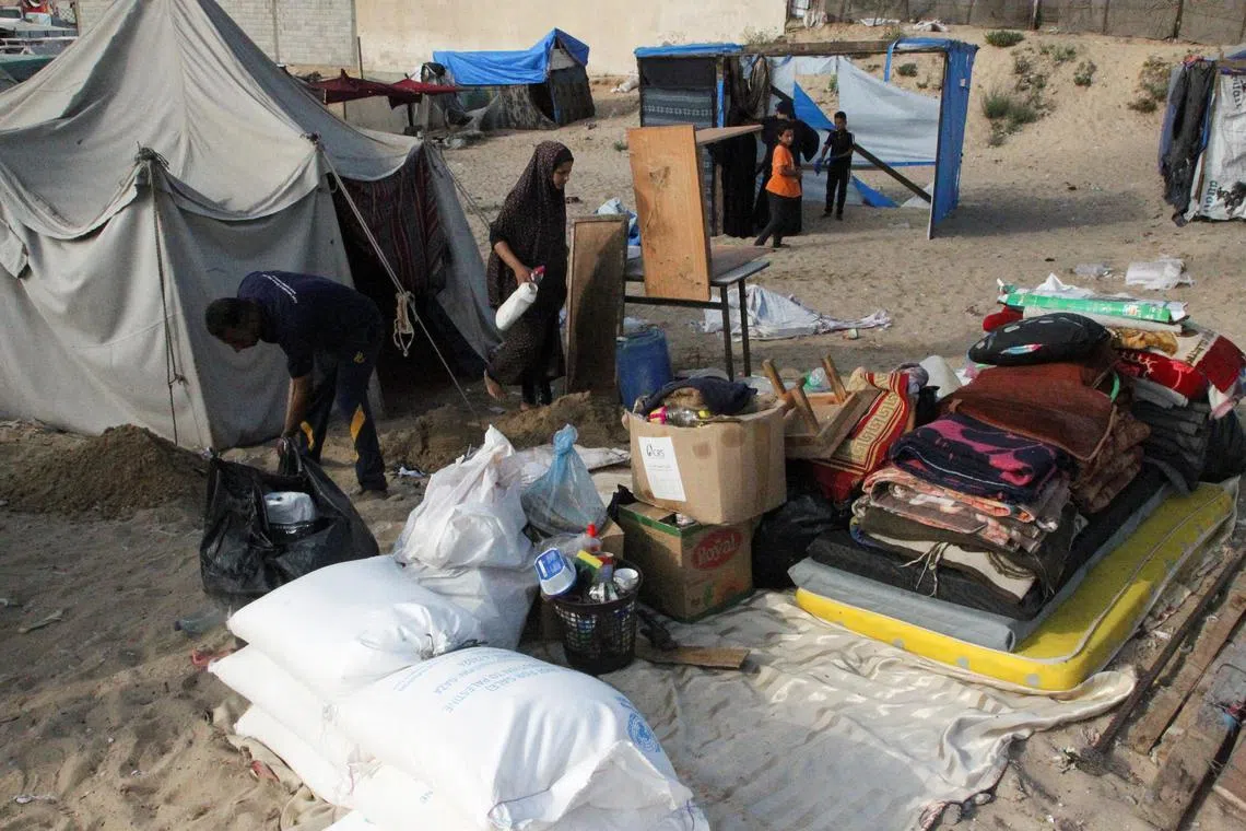 Palestinians flee Rafah due to an Israeli military operation, amid the Israel-Hamas conflict, in Rafah, in the southern Gaza Strip.