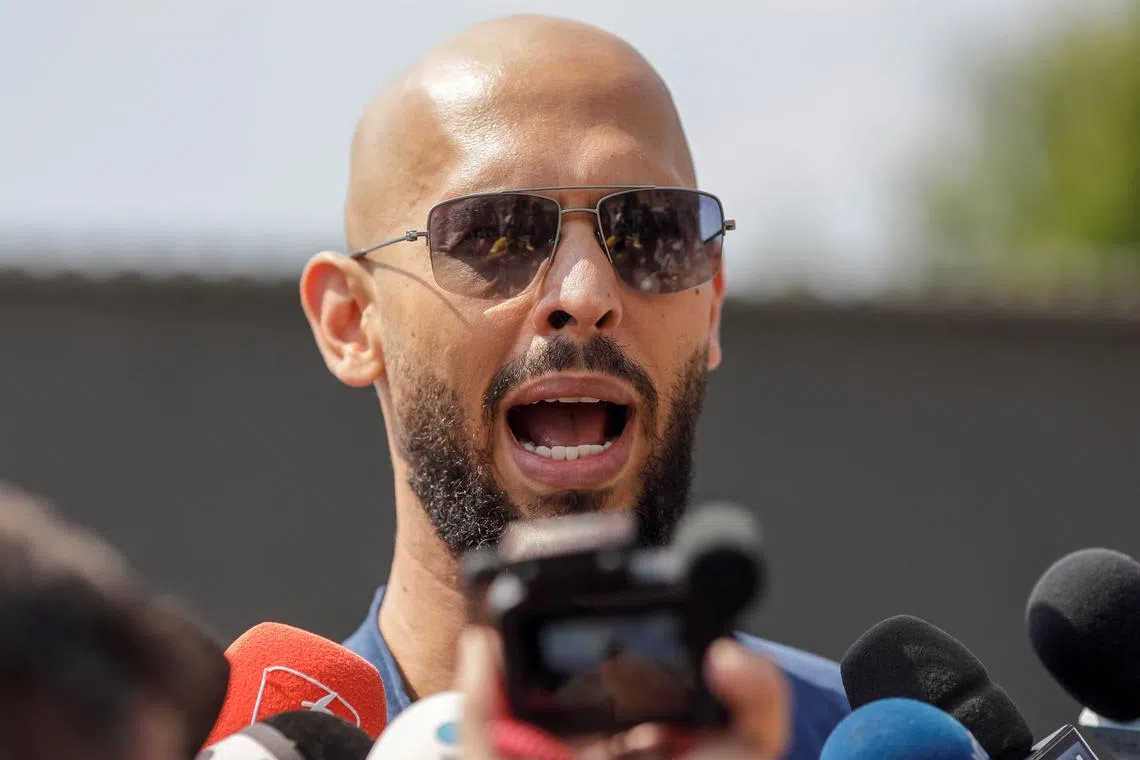FILE PHOTO: Andrew Tate delivers a press statement outside his house in Voluntari, Ilfov, Romania, August 4, 2023. Inquam Photos/George Calin via REUTERS/ File Photo