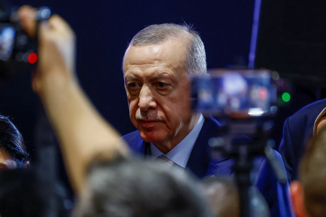 Turkey's President Tayyip Erdogan walks after speaking to the media, at the end of the G20 Leaders' Summit in Johannesburg, South Africa, November 23, 2025. REUTERS/Thomas Mukoya