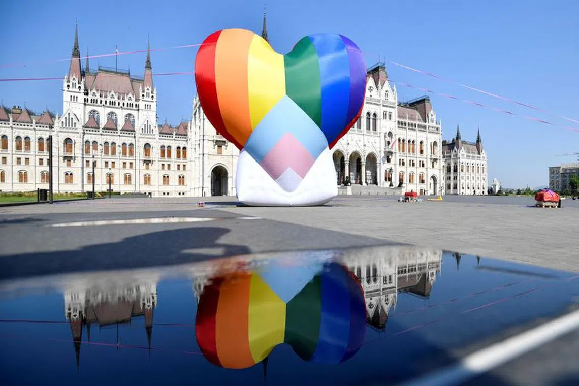 File photo: A huge rainbow baloon put up by members of Amnesty International and Hatter, an NGO promoting LGBT rights, is seen at Hungary's parliament in protest against anti-LGBT law in Budapest, Hungary, July 8, 2021. REUTERS/Marton Monus/File photo