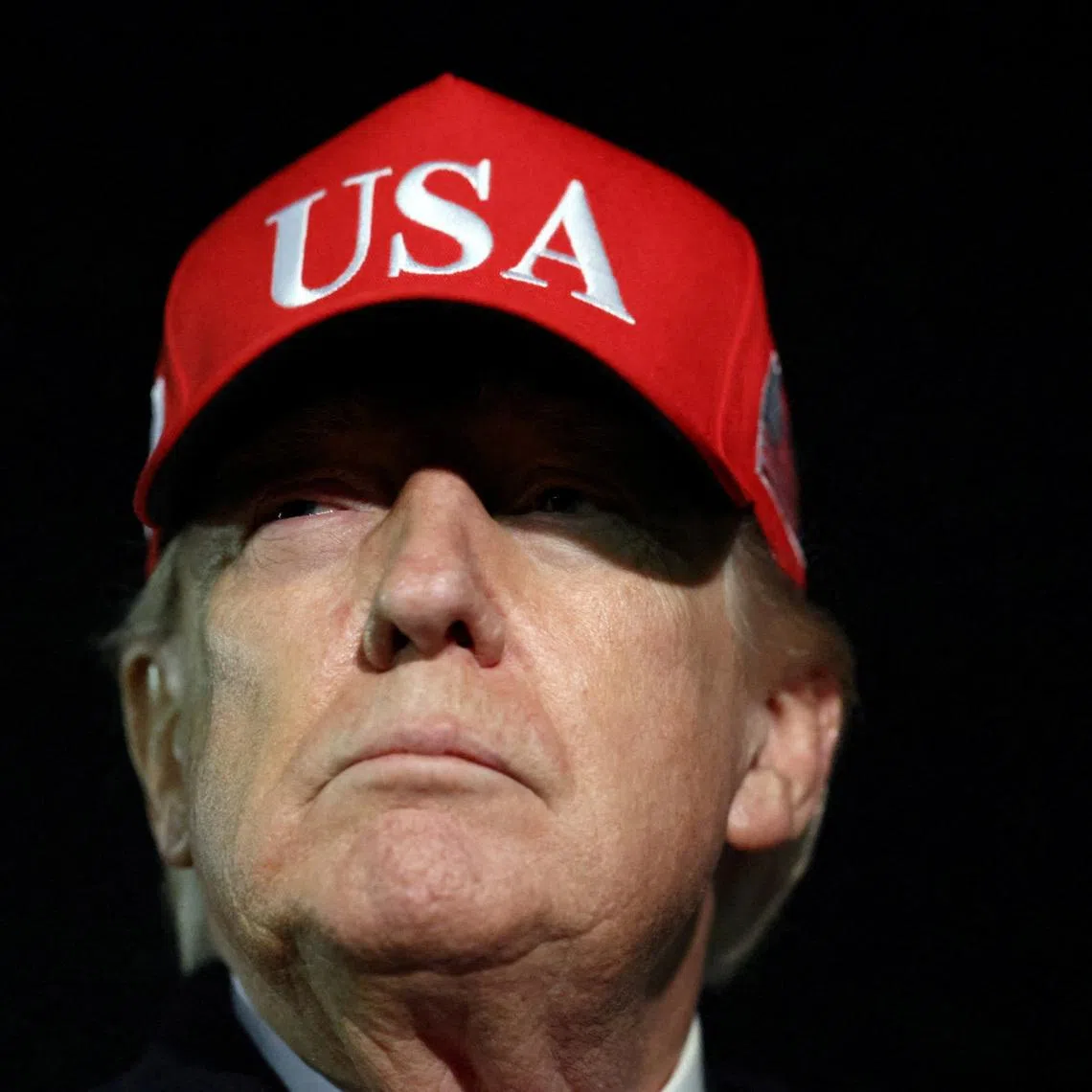 U.S. President Donald Trump looks on after disembarking Air Force One as he arrives at Joint Base Andrews in Maryland, U.S., April 12, 2026.  REUTERS/Kevin Lamarque