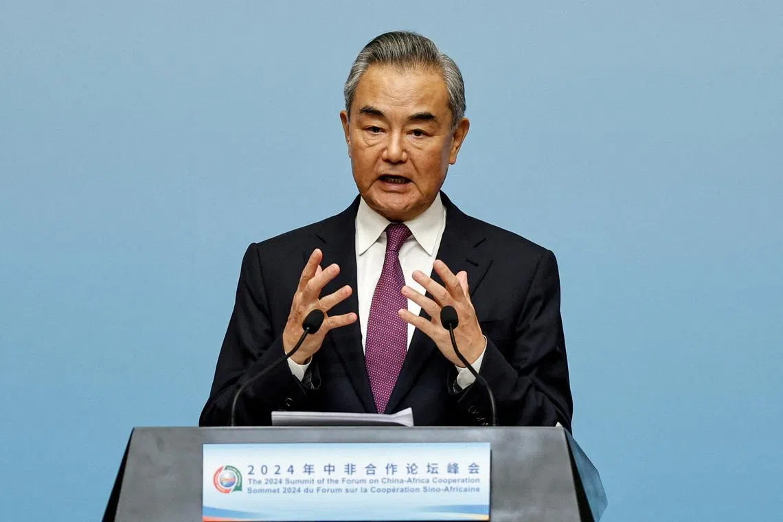 FILE PHOTO: China’s Foreign Minister Wang Yi speaks at a press conference during the 2024 Summit of the Forum on China-Africa Cooperation (FOCAC) in Beijing, China September 5, 2024. REUTERS/Tingshu Wang/File Photo