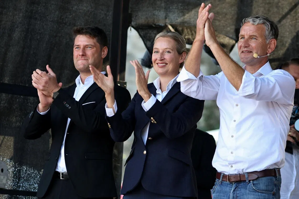 FILE PHOTO: Germany's Alternative for Germany (AfD) party co-leader Alice Weidel and AfD leader in Thuringia state Bjoern Hoecke applaud during an election campaign rally for the Thuringia state elections, in Erfurt, Germany August 31, 2024. REUTERS/Karina Hessland/File Photo