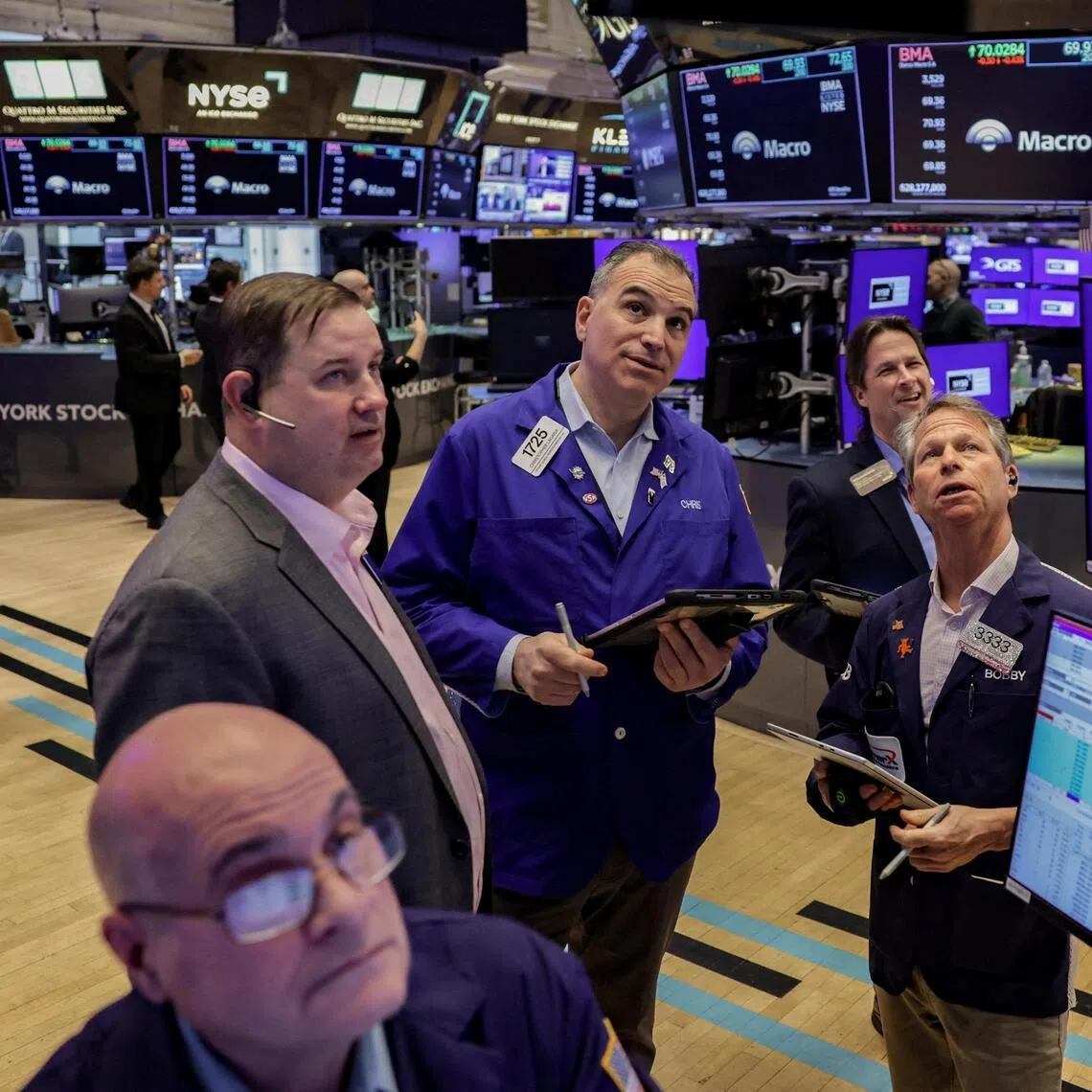 Traders work on the floor at the New York Stock Exchange in New York City on March 24.