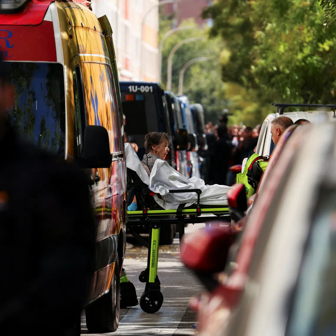 Maricarmen Abascal, 87, is transported on a stretcher to an ambulance, after she was evicted from the Madrid home where she had lived for more than seven decades.