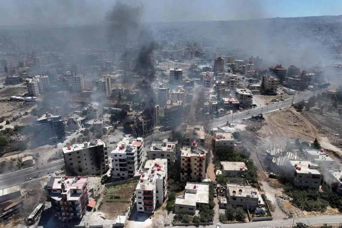 Smoke rising in the city of Sweida in southern Syria's Druze majority province on July 19, 2025.