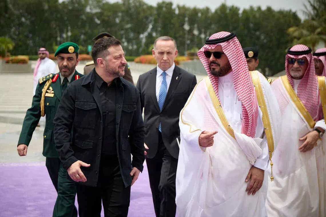 Ukrainian President Volodymyr Zelensky (left) arriving in Saudi Arabia on April 24.