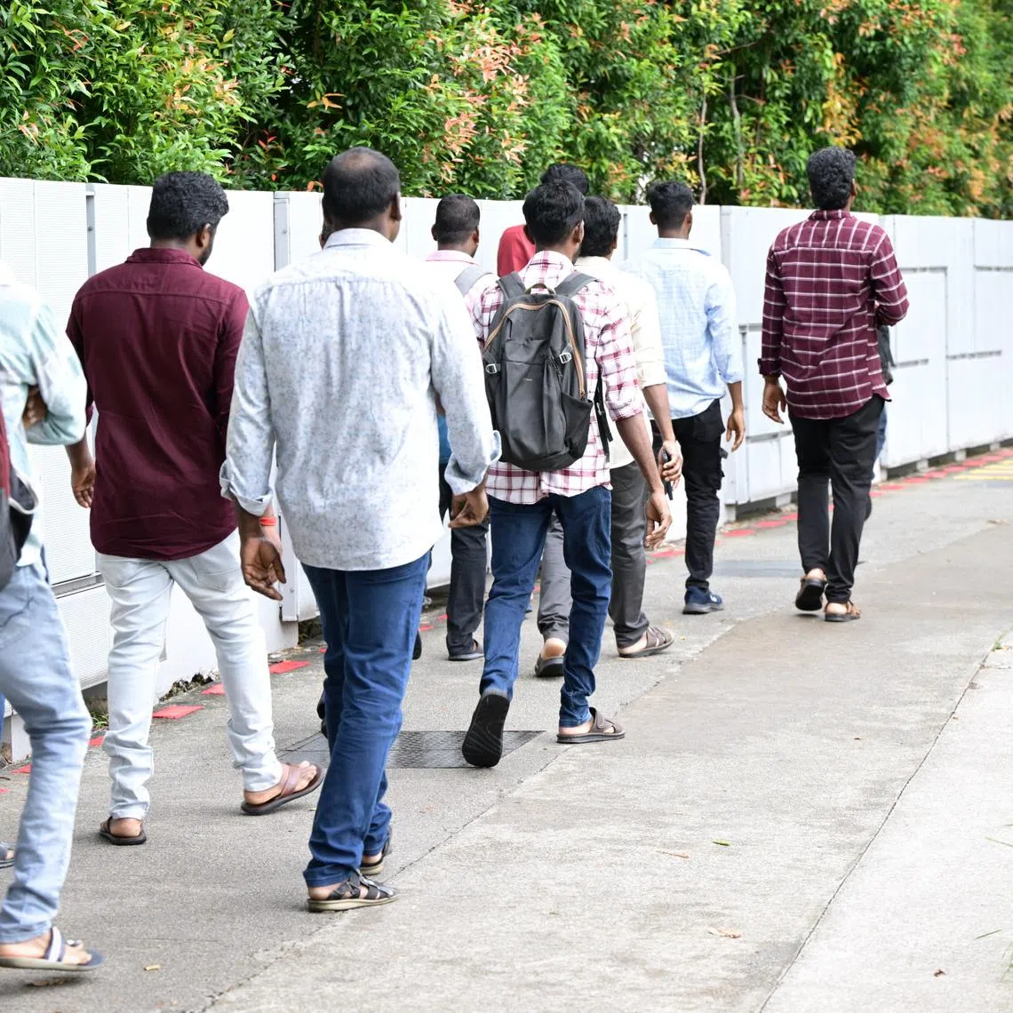 Migrant workers from KPA Engineering entering the MOM Services Centre in Bendemeer on June 22.
