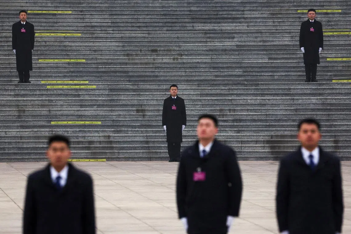 Security officials standing guard outside the Great Hall of the People ahead of the opening session of the Chinese People's Political Consultative Conference (CPPCC), in Beijing, China, on March 4, 2026. 