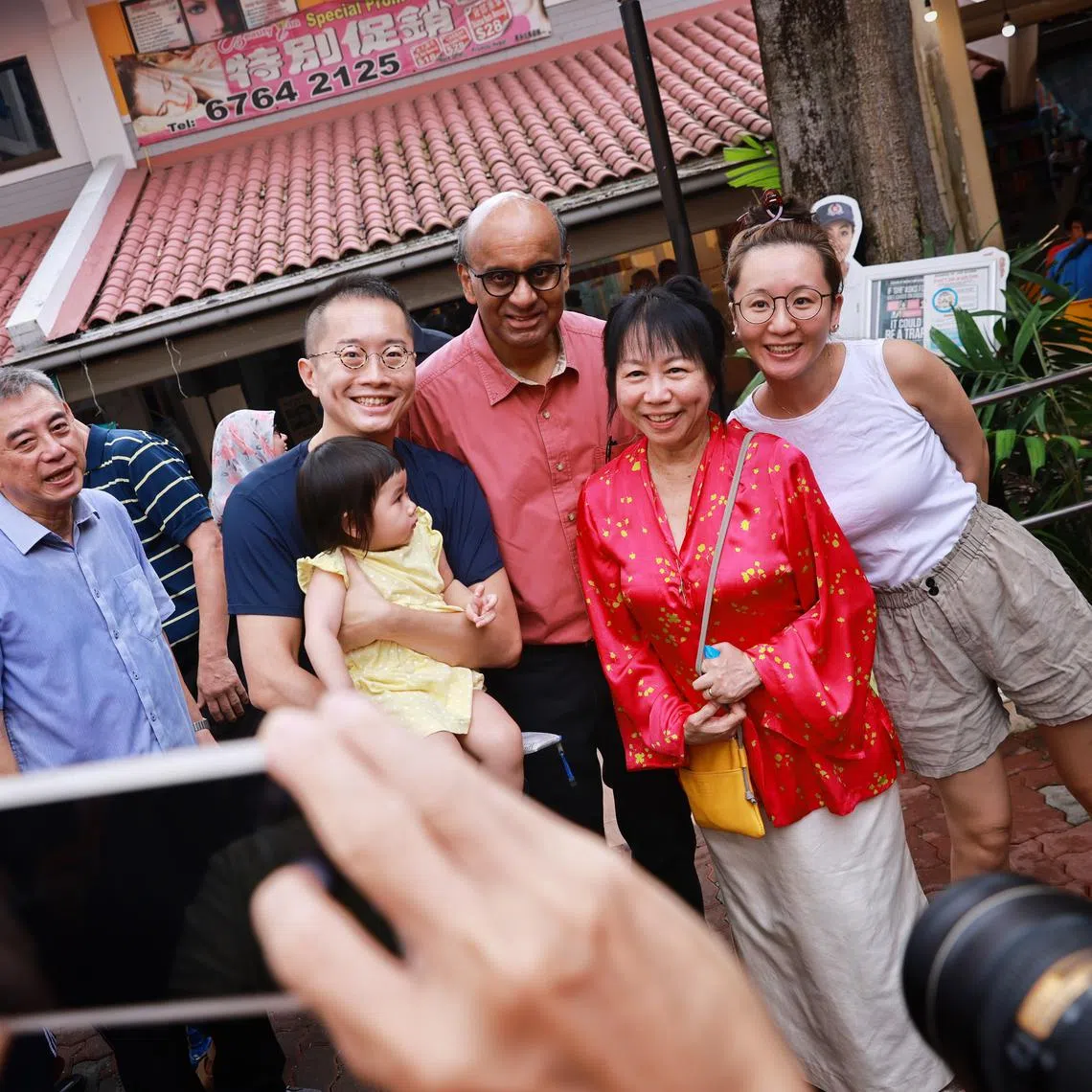 Mr Tharman Shanmugaratnam (centre) and his wife Jane Yumiko Ittogi (in red) meeting residents on July 15, 2023.