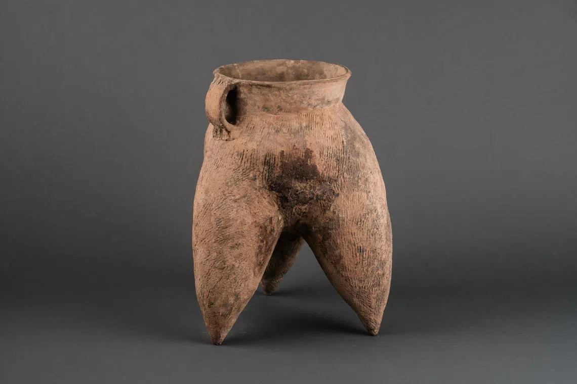 Large pottery tripod vessel from the Neolithic period Longshan culture (3000 to 1900 BCE) at the exhibition called Kaleidoscope In Clay (1) at Fort Canning Centre.
