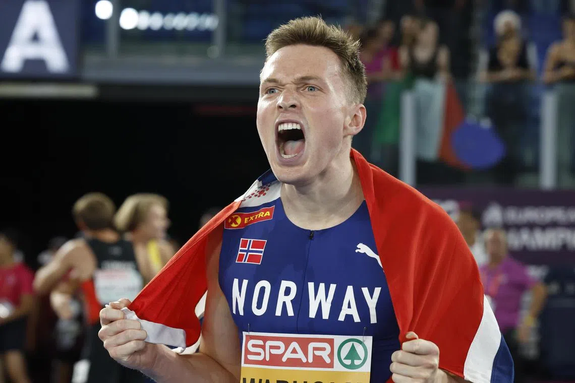 Norway's Karsten Warholm celebrates after winning the men's 400m hurdles final at the European Athletics Championship in Rome.