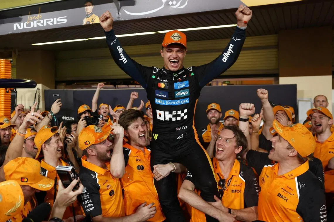 McLaren's Lando Norris celebrates with this team after becoming the 2025 Formula One World Champion.