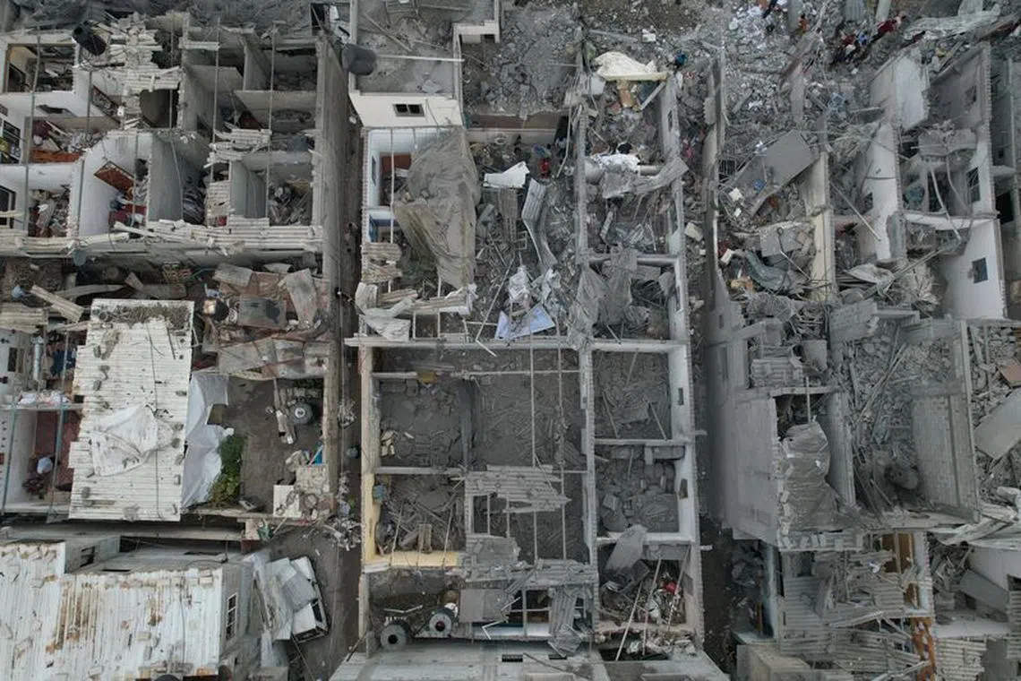 A view of the remains of a mosque and houses destroyed by Israeli strikes in the central Gaza Strip October 29, 2023. REUTERS/Mohammed Fayq Abu Mostafa