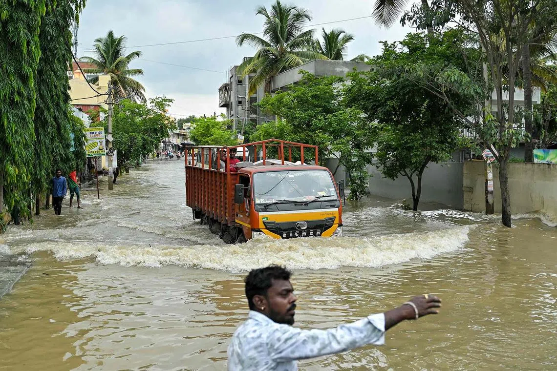 A truck making its way through a flooded street following heavy rainfall in Bengaluru, India, on May 19, 2025. 