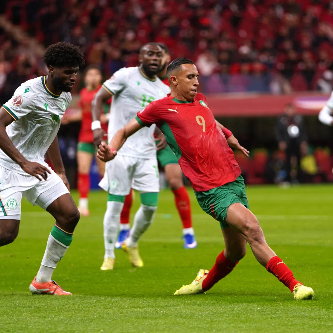 Soccer Football - CAF Africa Cup of Nations - Morocco 2025 - Group A - Morocco v Comoros - Prince Moulay Abdellah Stadium, Rabat, Morocco - December 21, 2025 Morocco's Soufiane Rahimi in action with Comoros' Kenan Toibibou REUTERS/Stringer