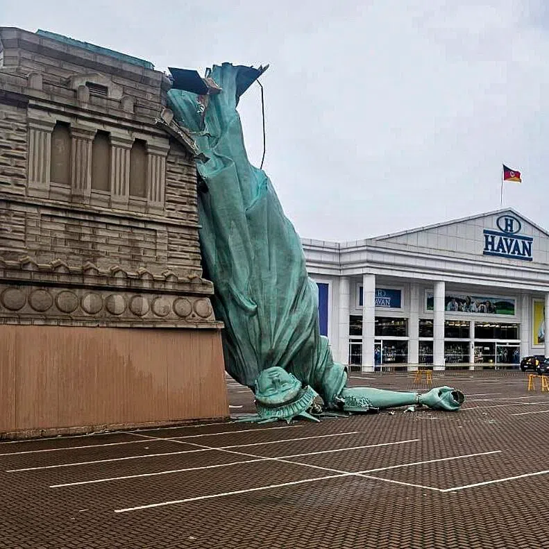 A replica of the Statue of Liberty that collapsed onto a carpark amid severe weather in the Brazilian state of Rio Grande do Sul.