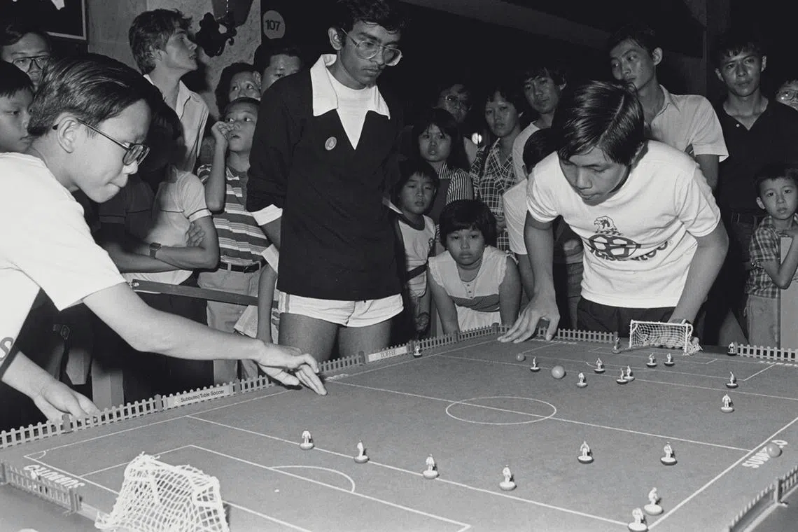 200 contestants took part in the Singapore national Subbuteo championship held at Plaza Singapura. The first national Subbuteo champions, C Chandru, 21, and schoolboy Teng Lip Chiang, 14, who emerged the winners will represent Singapore in Barcelona next month for the Subbuteo World Cup Championships. Subbuteo is played with colourful figures on a mini-pitch. It is played on a table top using fingers, instead of feet.