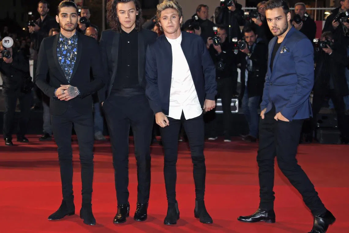 FILE PHOTO: (L-R) British boy band One Direction members Zayn Malik, Harry Styles, Niall Horan and Liam Payne arrive for the NRJ Music Awards ceremony at the Festival Palace in Cannes. REUTERS/Eric Gaillard/File photo