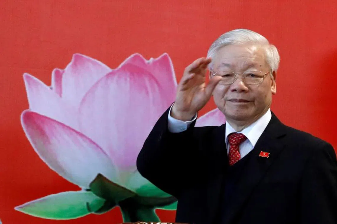 FILE PHOTO: Vietnam's President Nguyen Phu Trong greets media at a news conferance after he is re-elected as Communist Party's General Secretary for the 3rd term after the closing ceremony of 13th national congress of the ruling communist party in Hanoi, Vietnam February 1, 2021. REUTERS/Kham