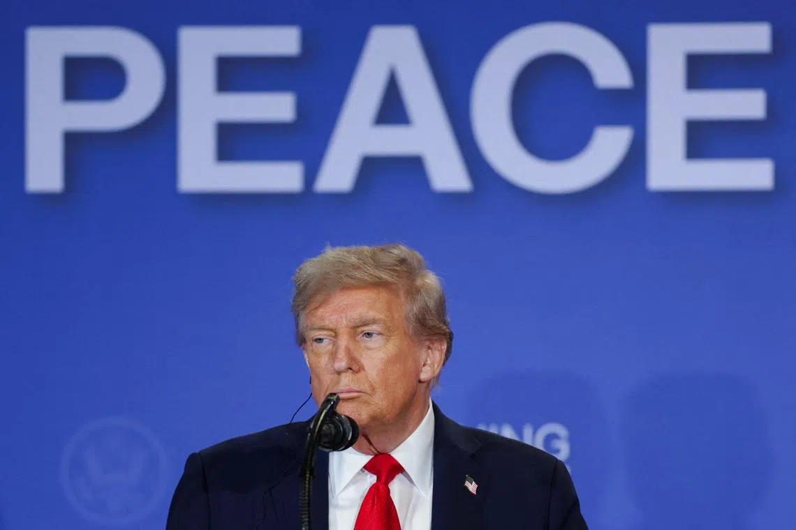 U.S. President Donald Trump holds a press conference with Russian President Vladimir Putin following their meeting to negotiate an end to the war in Ukraine, at Joint Base Elmendorf-Richardson in Anchorage, Alaska, U.S., August 15, 2025. REUTERS/Jeenah Moon