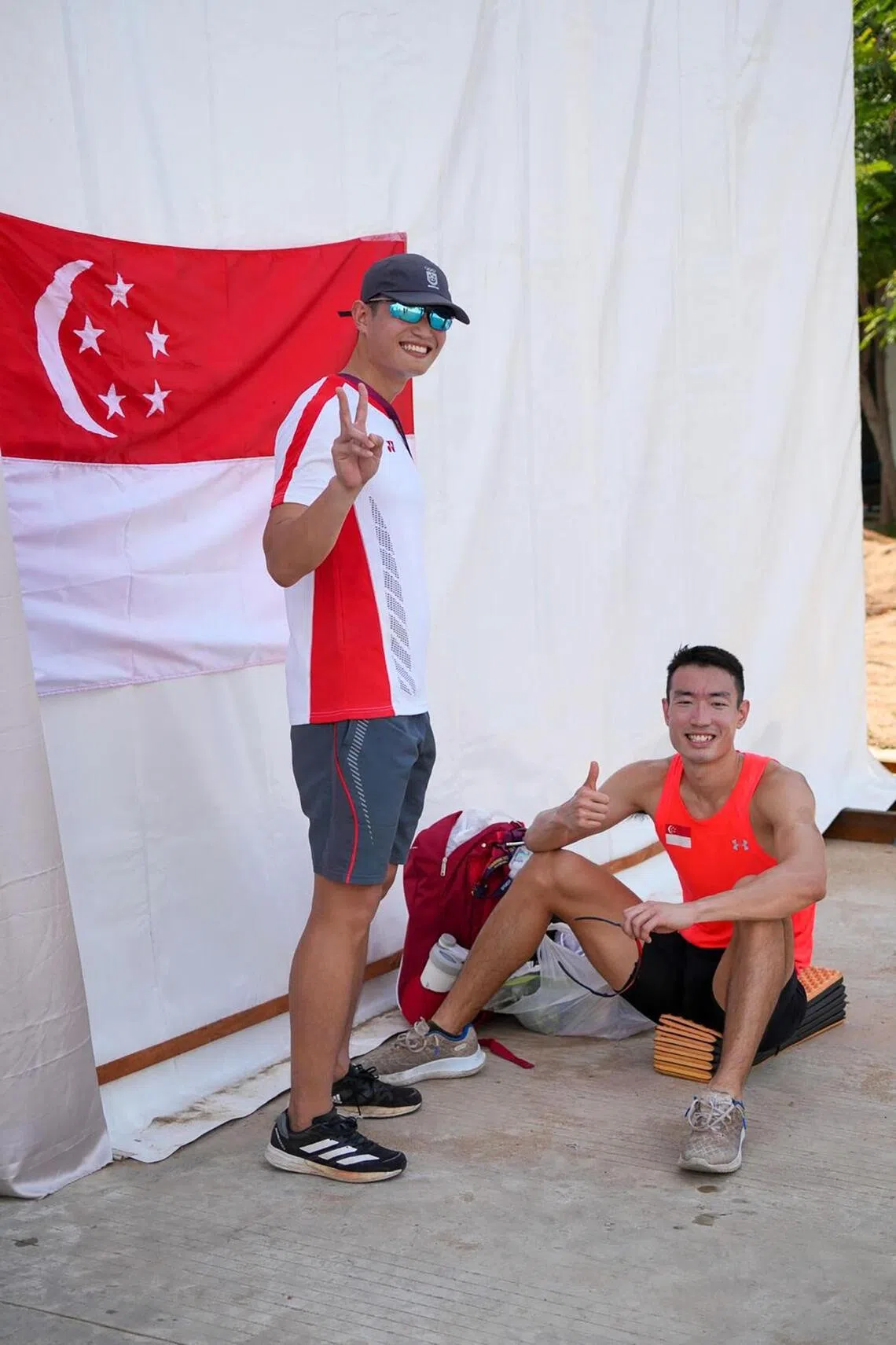 Ang Ding Hui (left) did not just compete alongside his older brother Ang Chen Xiang, he also coached the national record holder on his way to becoming 2023 SEA Games champion.